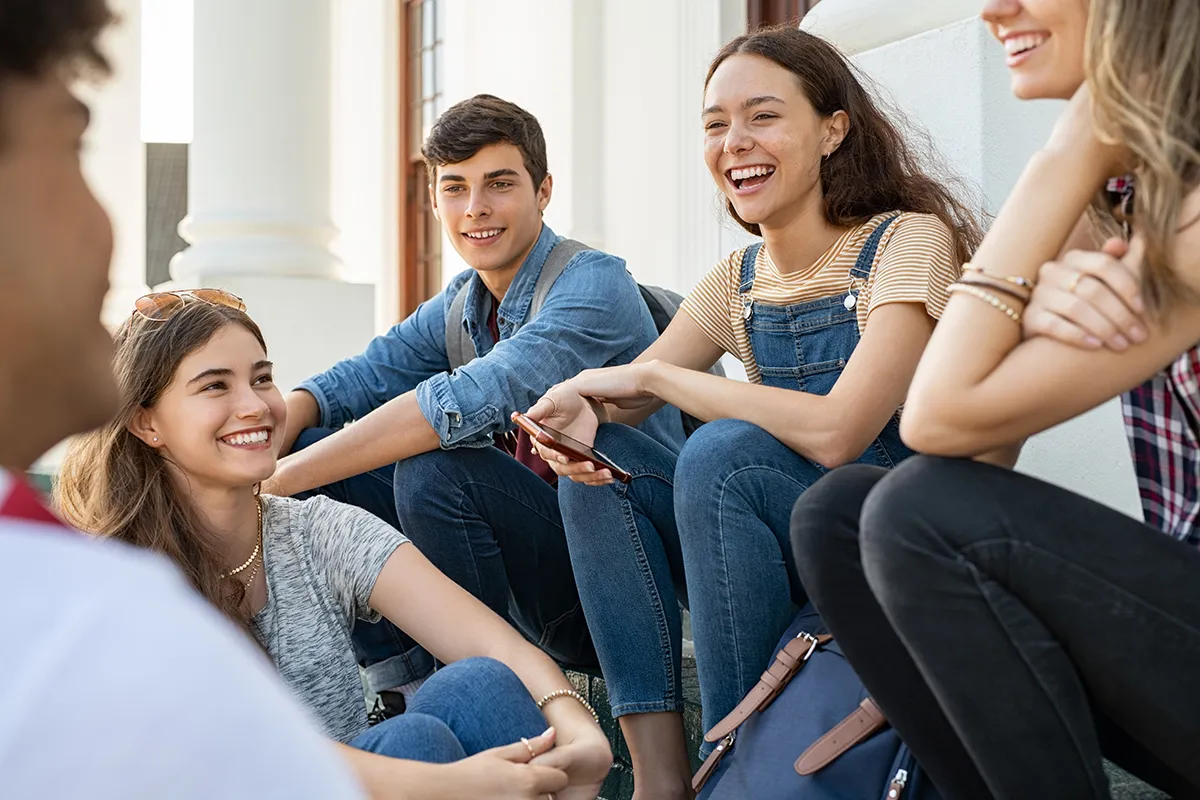 teenager friends sitting together and laughing 2023 11 27 05 29 20 utc