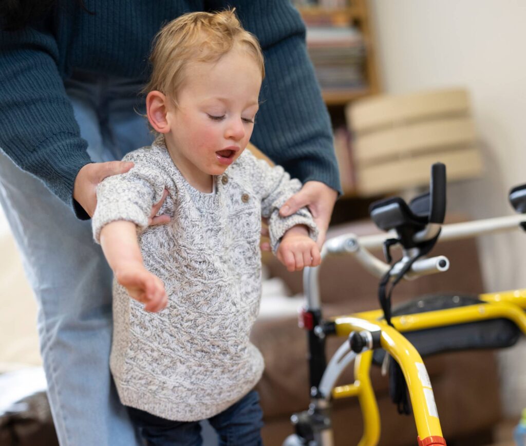 Mother,Assisting,Son,With,Cerebral,Palsy,In,Walking?